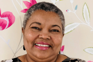 Adaobi Akki, Service Manager at Woodland Court, smiling at the camera.